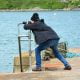 Photographer at harbour searching for the perfect image