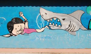 shark closing in on little girl