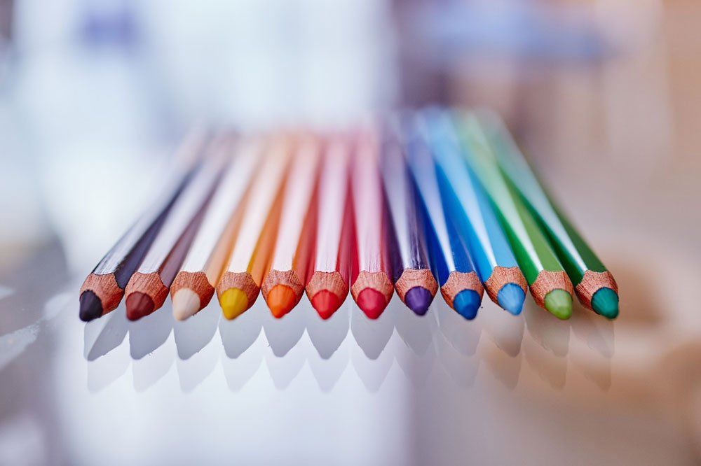 Coloured pencils in a row