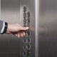 male hand pressing button on elevator