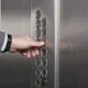 male hand pressing button on elevator