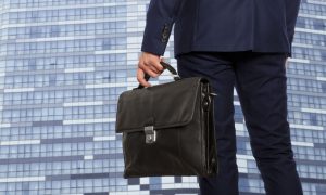 Business man with briefcase pitching to investors