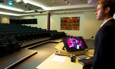 speaker practising in empty auditorium