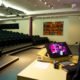 speaker practising in empty auditorium