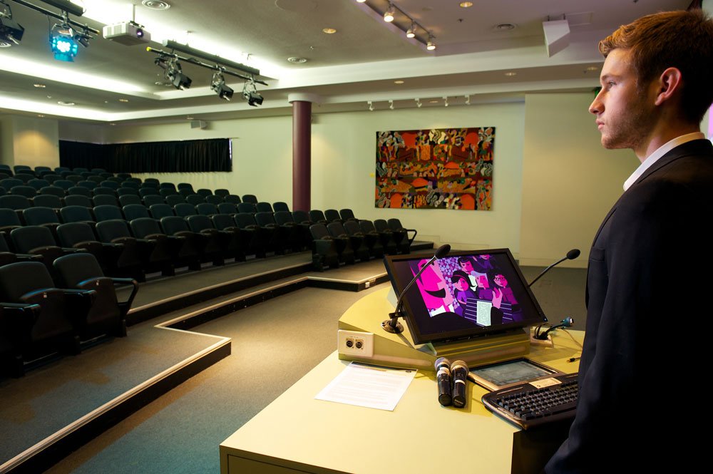 speaker practising in empty auditorium