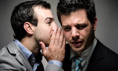 whispering a secret to a nervous speaker