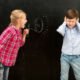 girl shouting at boy through loudhailer