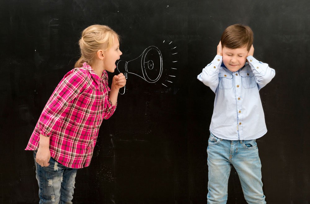 girl shouting at boy through loudhailer