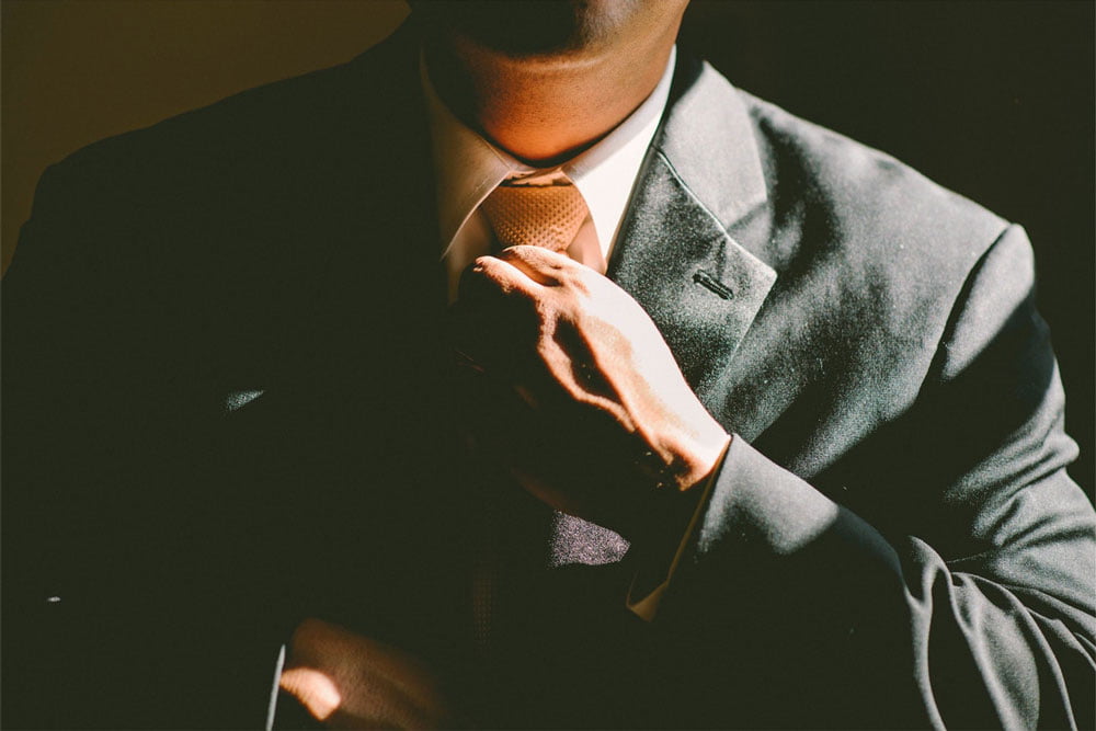 Successful speaker tying tie