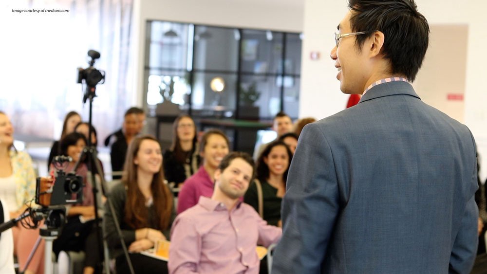 Kit Pang speaking to an audience