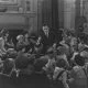 Storyteller with large group of children