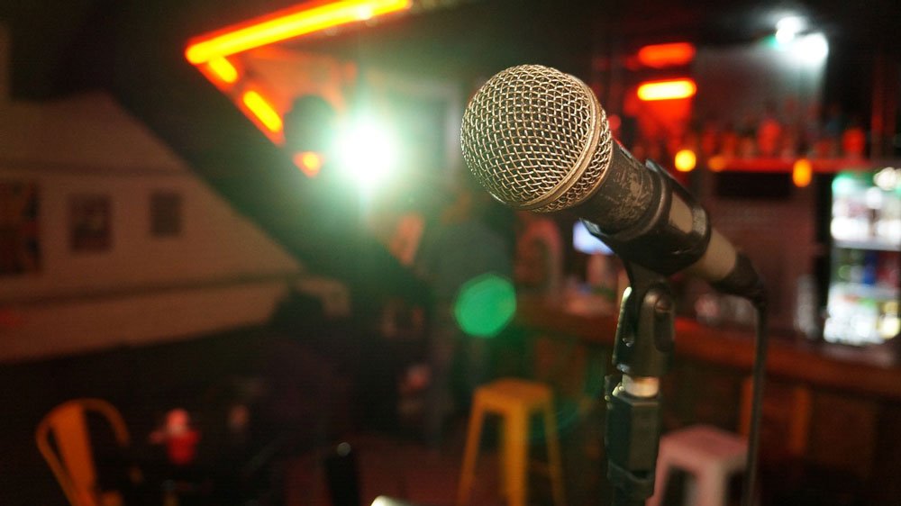 microphone set up in bar for comedy act