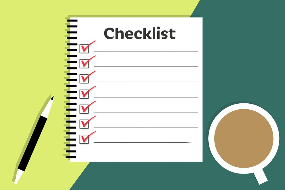 illustration of checklist on paper beside cup of tea